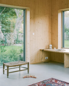 Maison passive en CLT à enveloppe en poutres en I et isolation ouate de cellulose