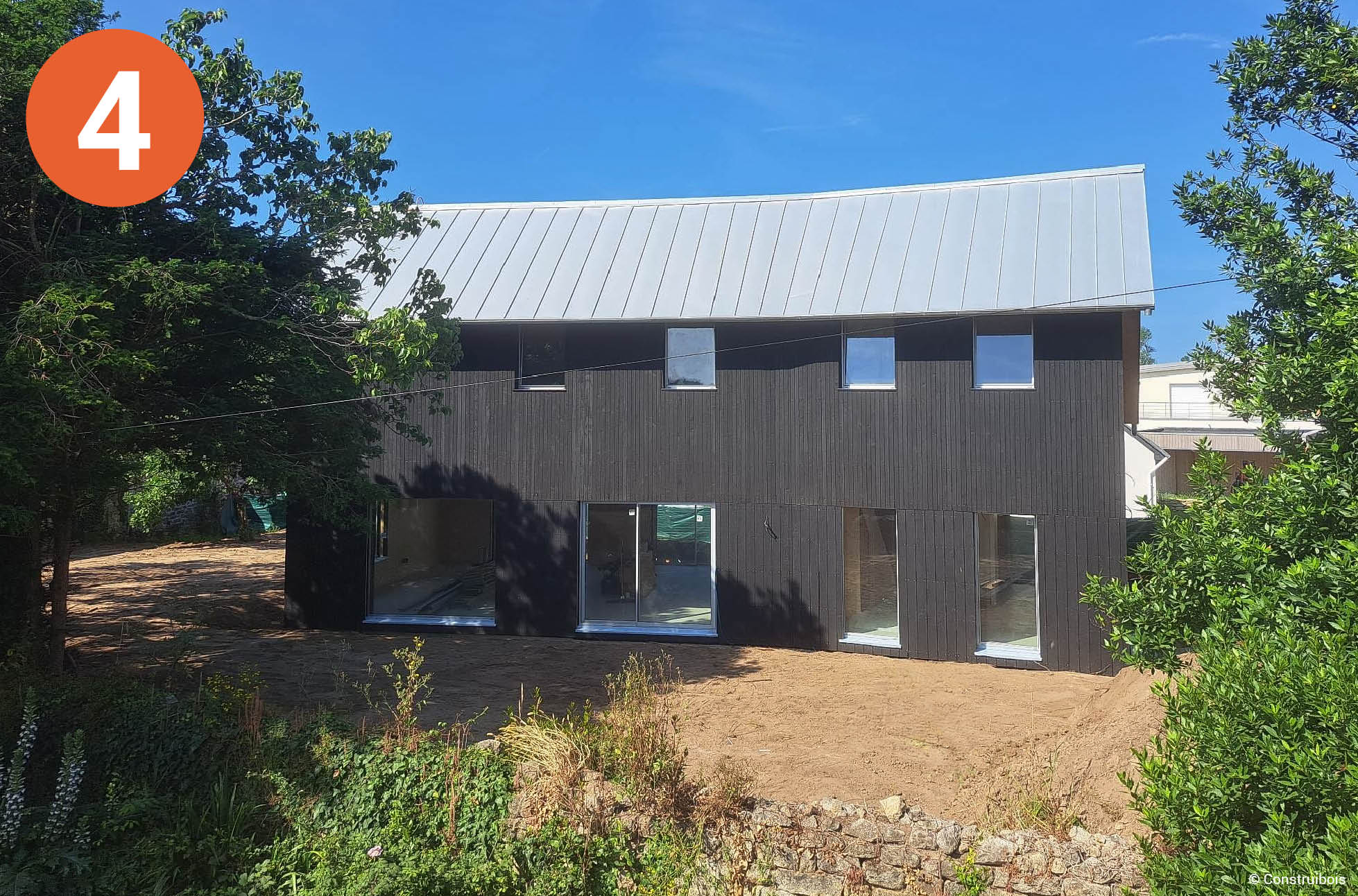 Maison passive en CLT à enveloppe en poutres en I et isolation ouate de cellulose